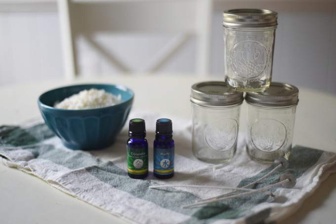 DIY Citronella Candles to keep mosquitos away from your picnics and outdoor gatherings in the summer! Easy to make using soy wax and essential oils. | Feathers in Our Nest